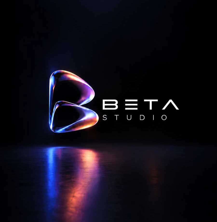 The Beta Studio logo under a spotlight, reflected on a dark floor.
